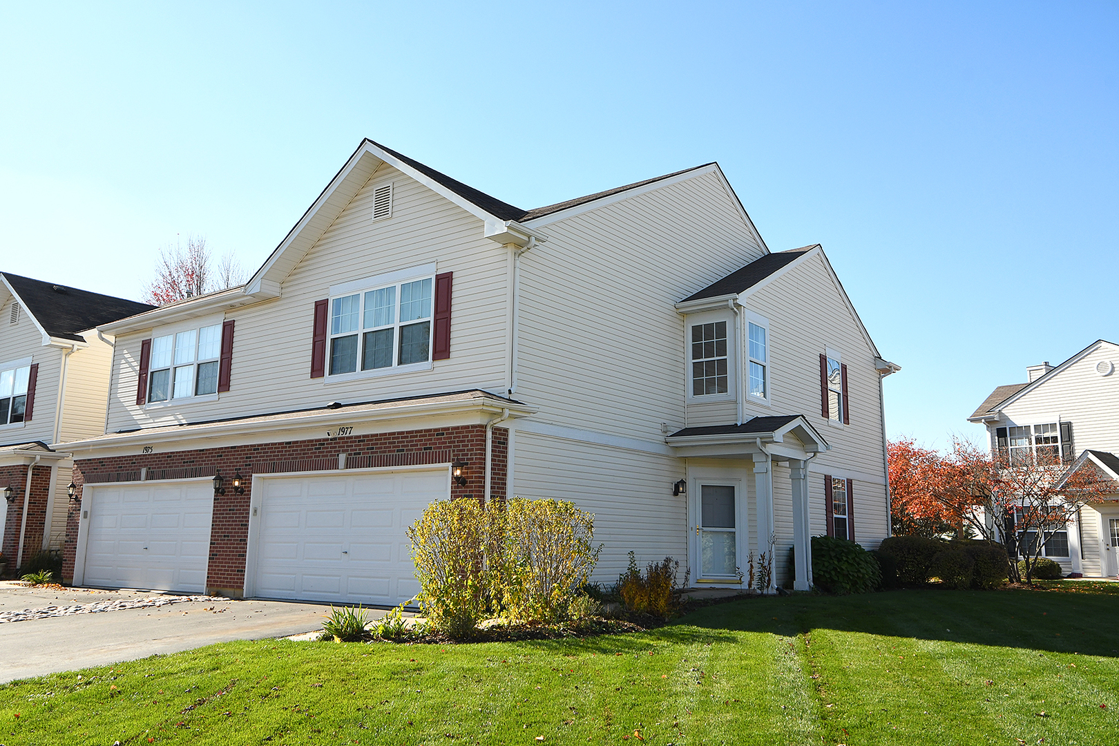 1977 Crestview Circle, Unit 1973 Romeoville, IL 60446 - Photo 1 of 19 a front view of a house with garden