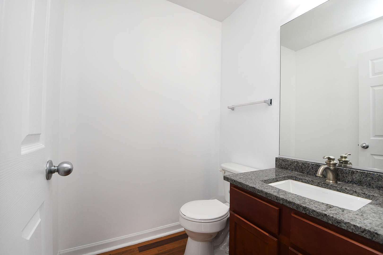 1977 Crestview Circle, Unit 1973 Romeoville, IL 60446 - Photo 12 of 19 a bathroom with a granite countertop sink and a toilet
