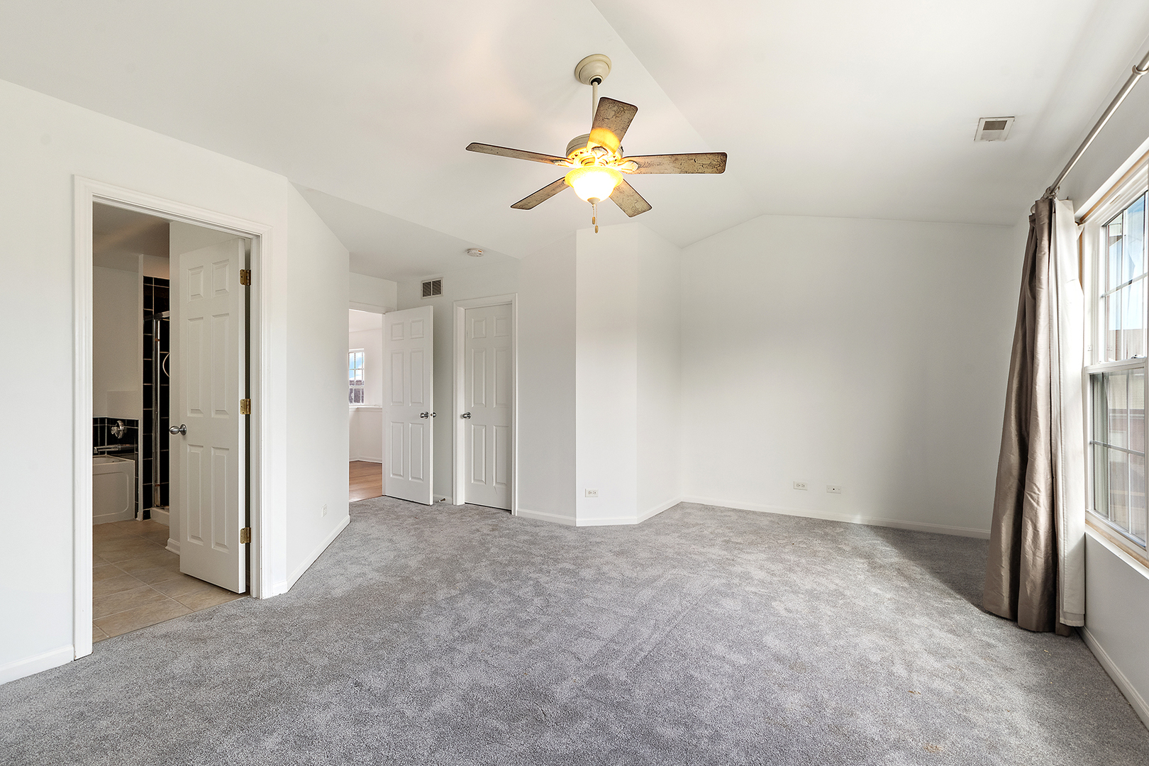 1977 Crestview Circle, Unit 1973 Romeoville, IL 60446 - Photo 16 of 19 a view of empty room with window and ceiling fan