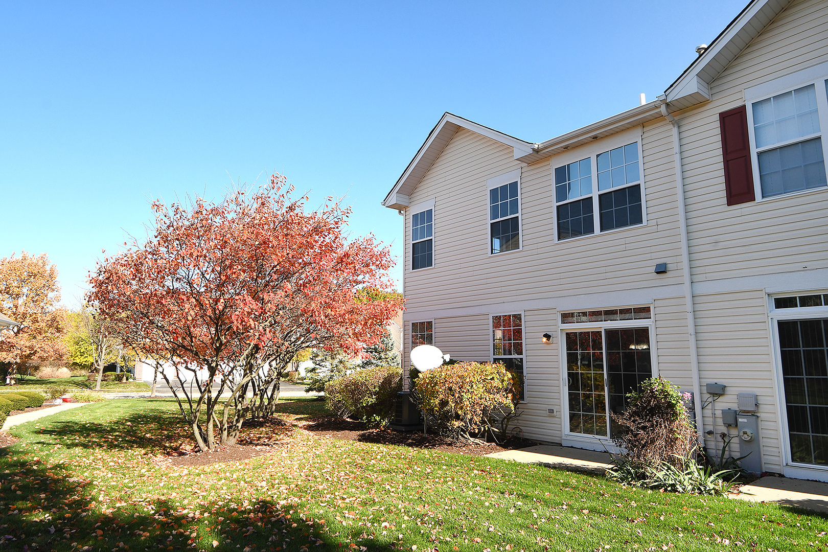 1977 Crestview Circle, Unit 1973 Romeoville, IL 60446 - Photo 2 of 19 a front view of a house with garden