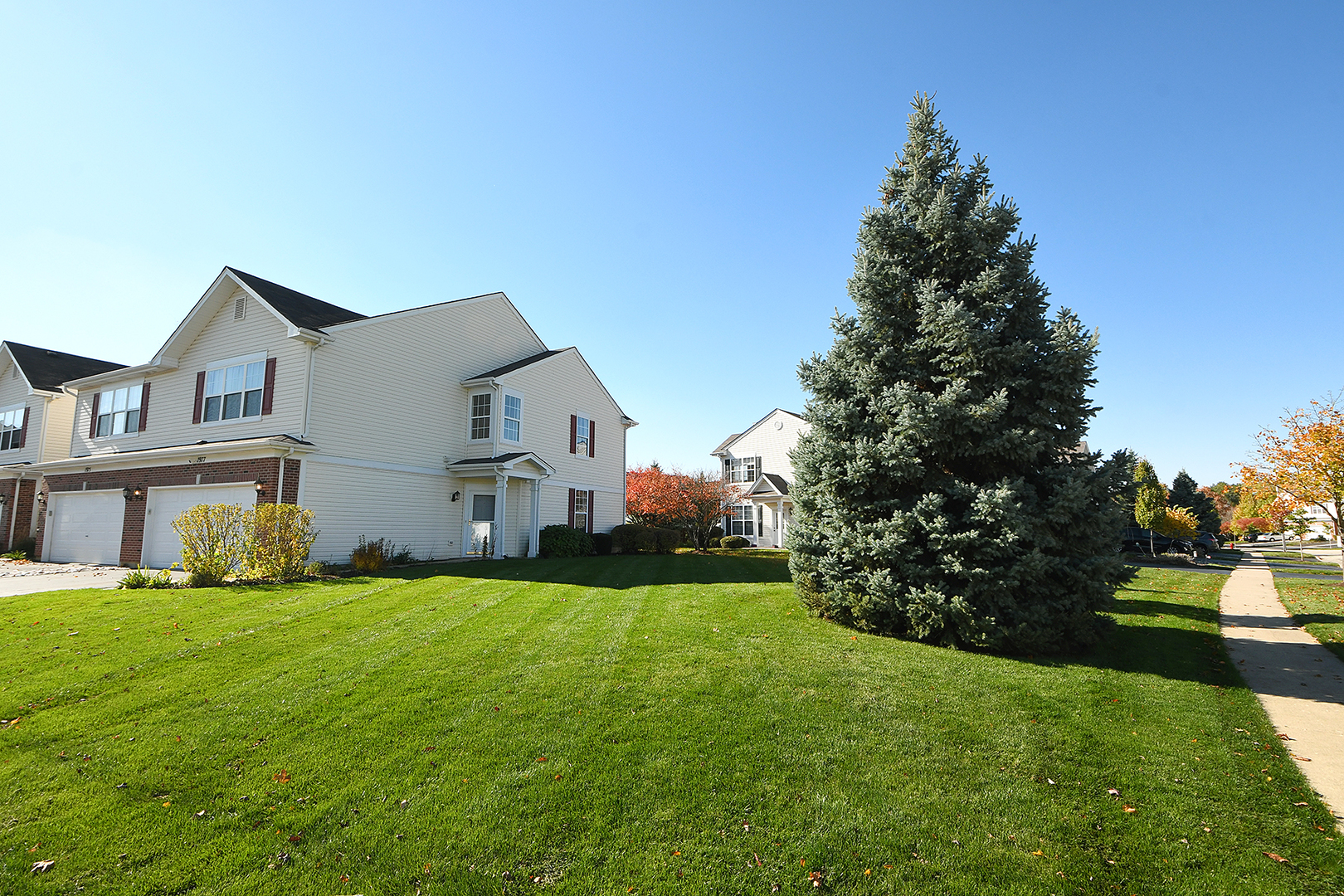 1977 Crestview Circle, Unit 1973 Romeoville, IL 60446 - Photo 3 of 19 a house view with garden space