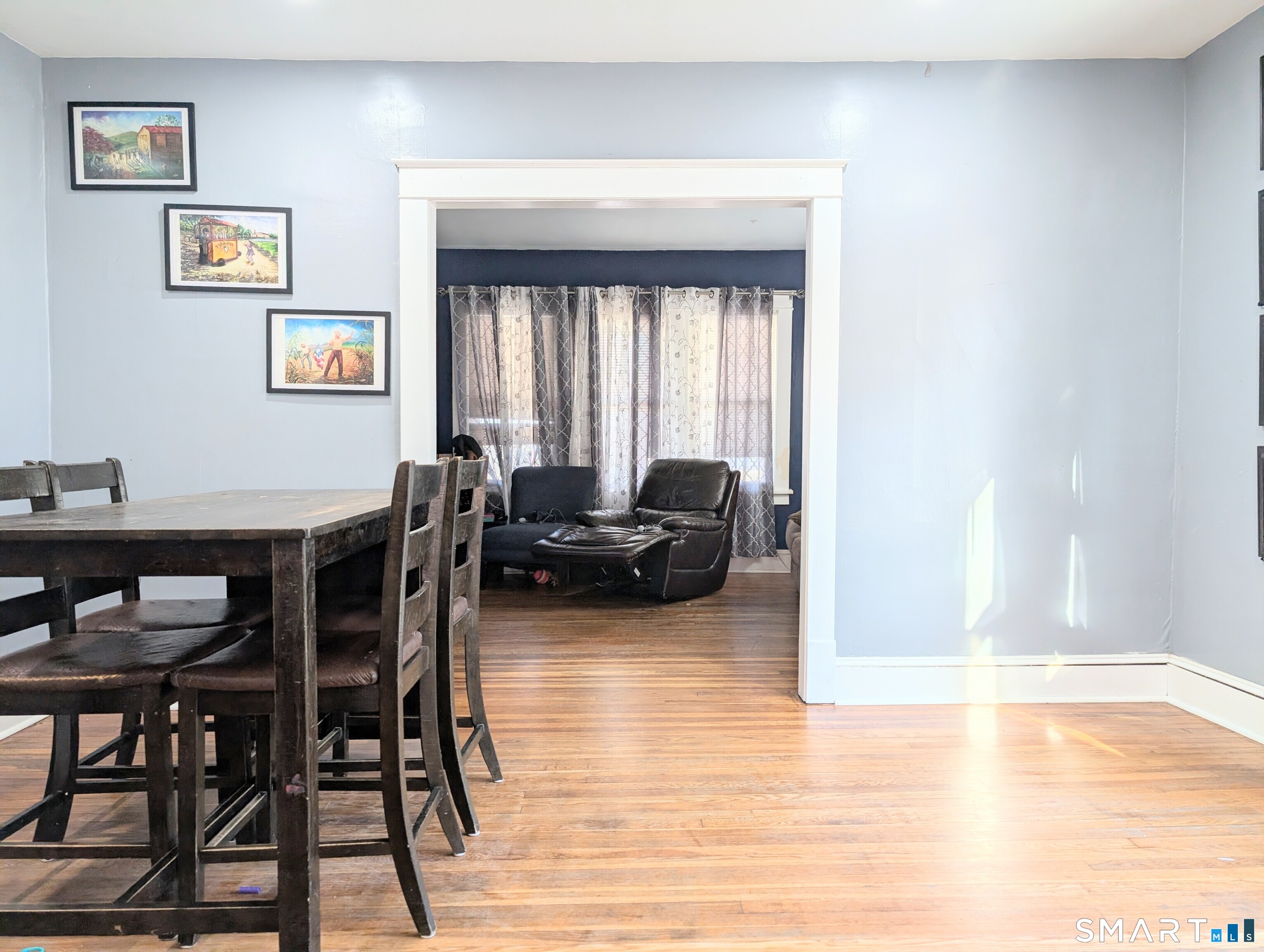 905 Cooke Street Waterbury, CT 06704 - Photo 11 of 42 a living room with furniture and a large window