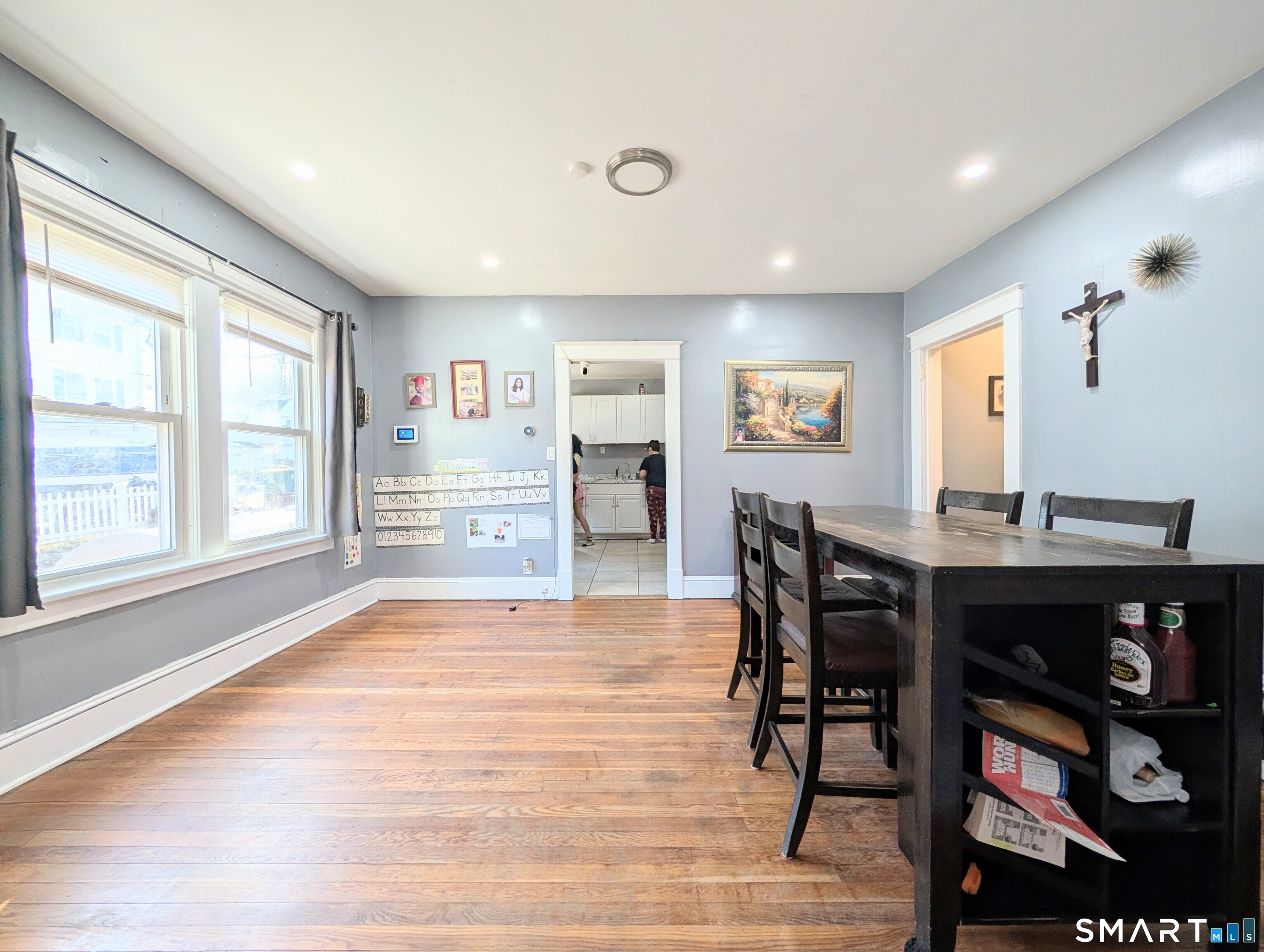 905 Cooke Street Waterbury, CT 06704 - Photo 12 of 42 a view of a dining room with furniture window and wooden floor