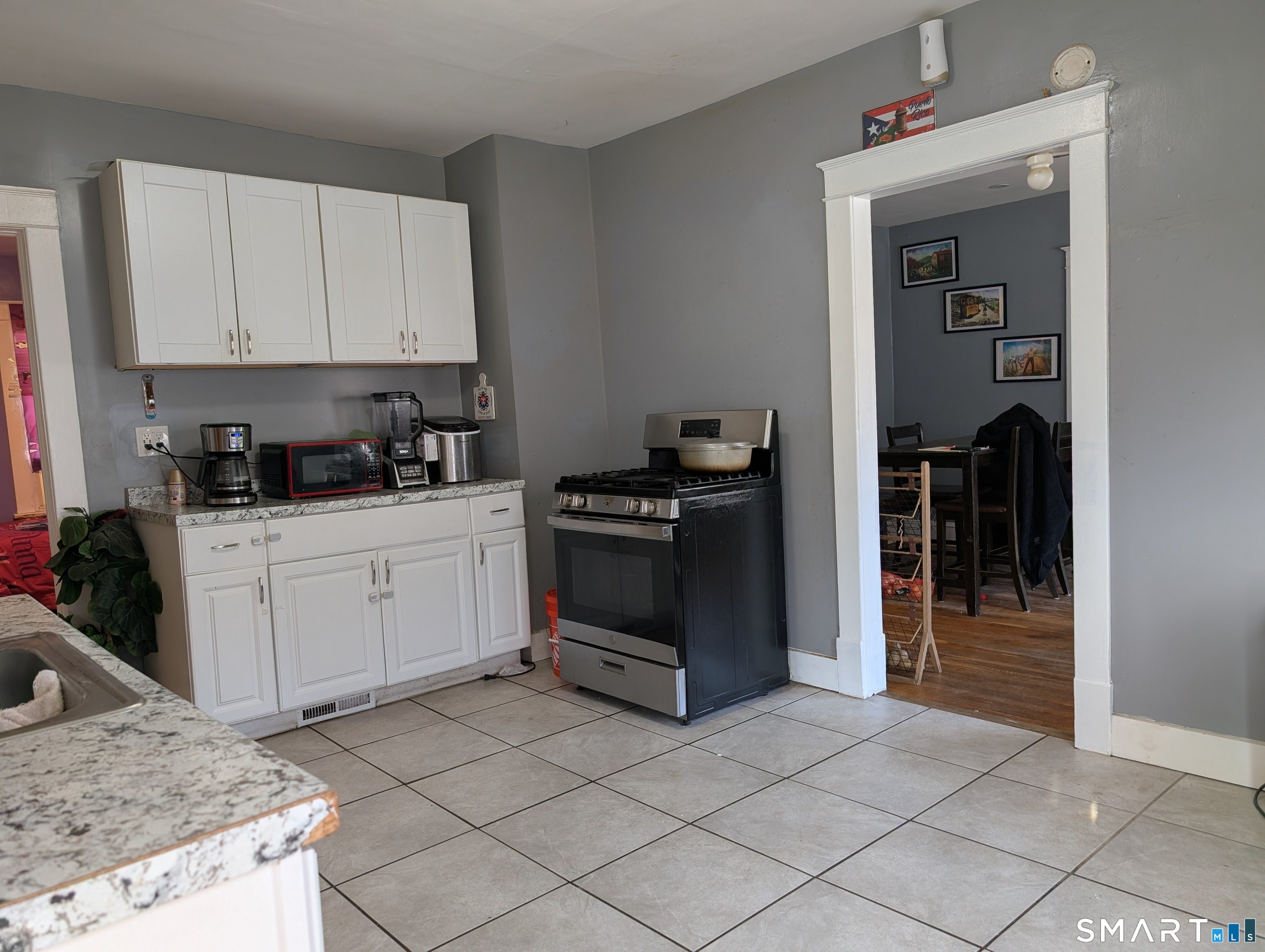 905 Cooke Street Waterbury, CT 06704 - Photo 15 of 42 a kitchen with a stove and a sink
