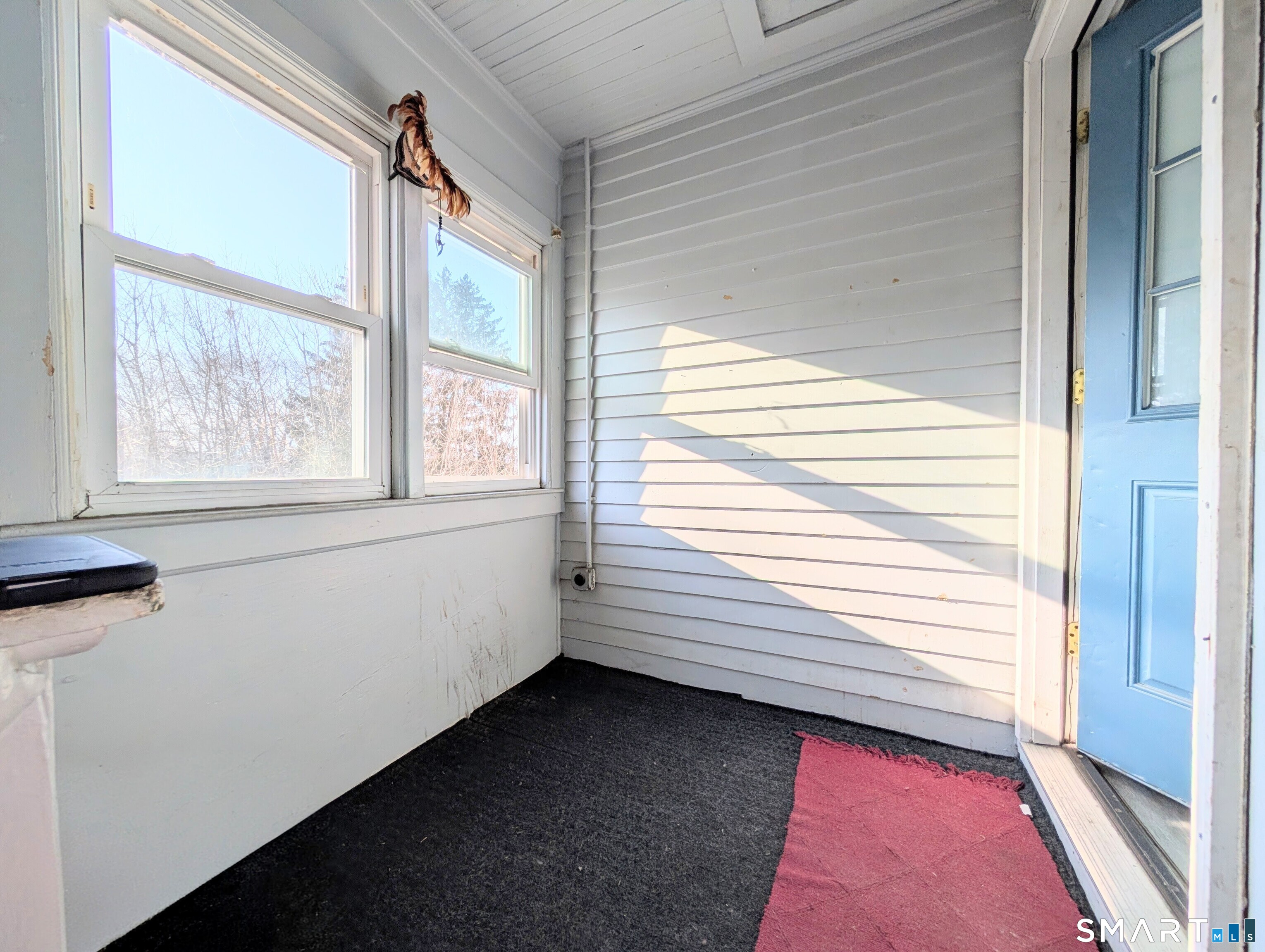 905 Cooke Street Waterbury, CT 06704 - Photo 24 of 42 a view of a small space with wooden floor and a window