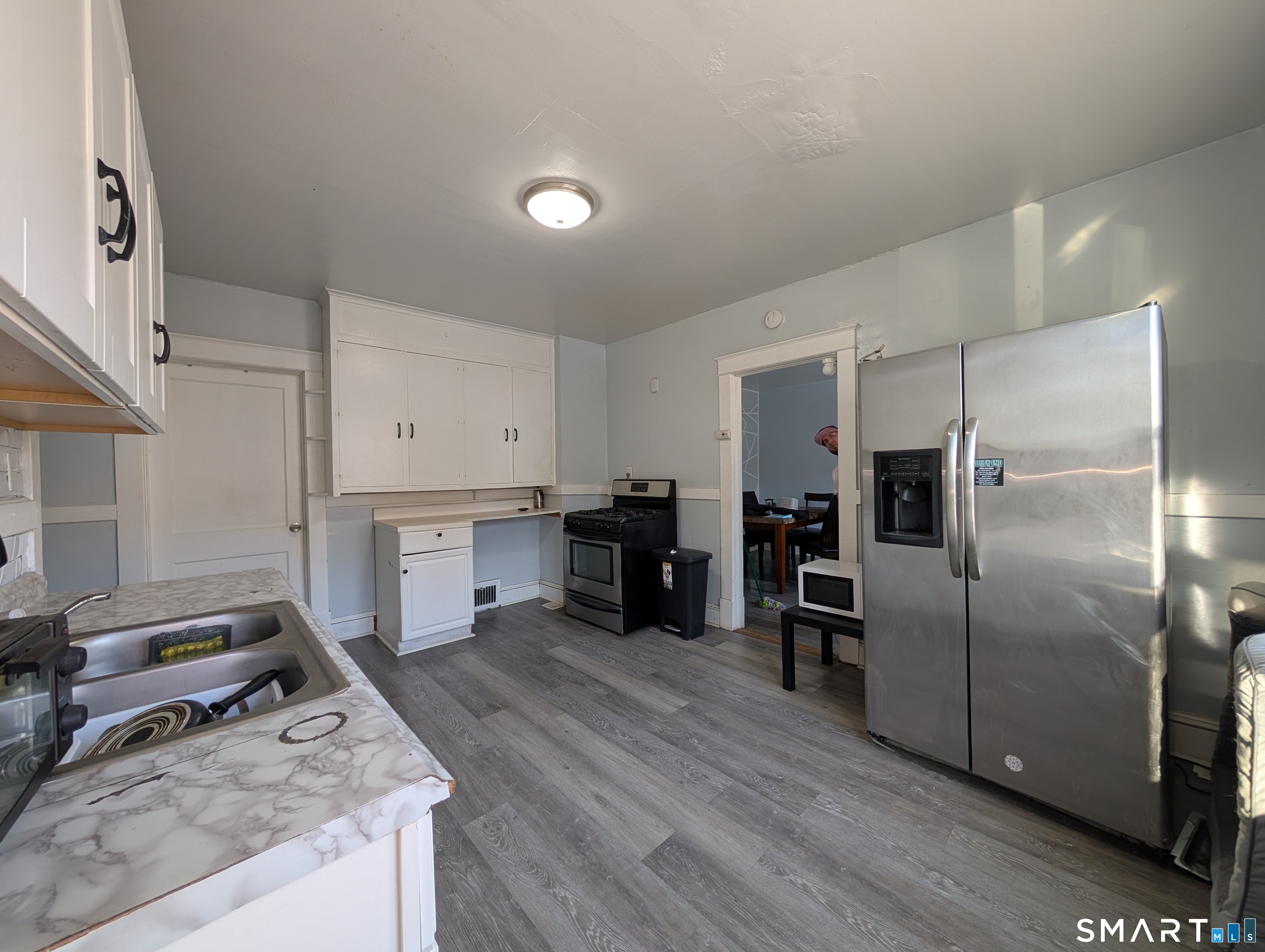 905 Cooke Street Waterbury, CT 06704 - Photo 26 of 42 a kitchen with stainless steel appliances granite countertop a refrigerator and a stove top oven