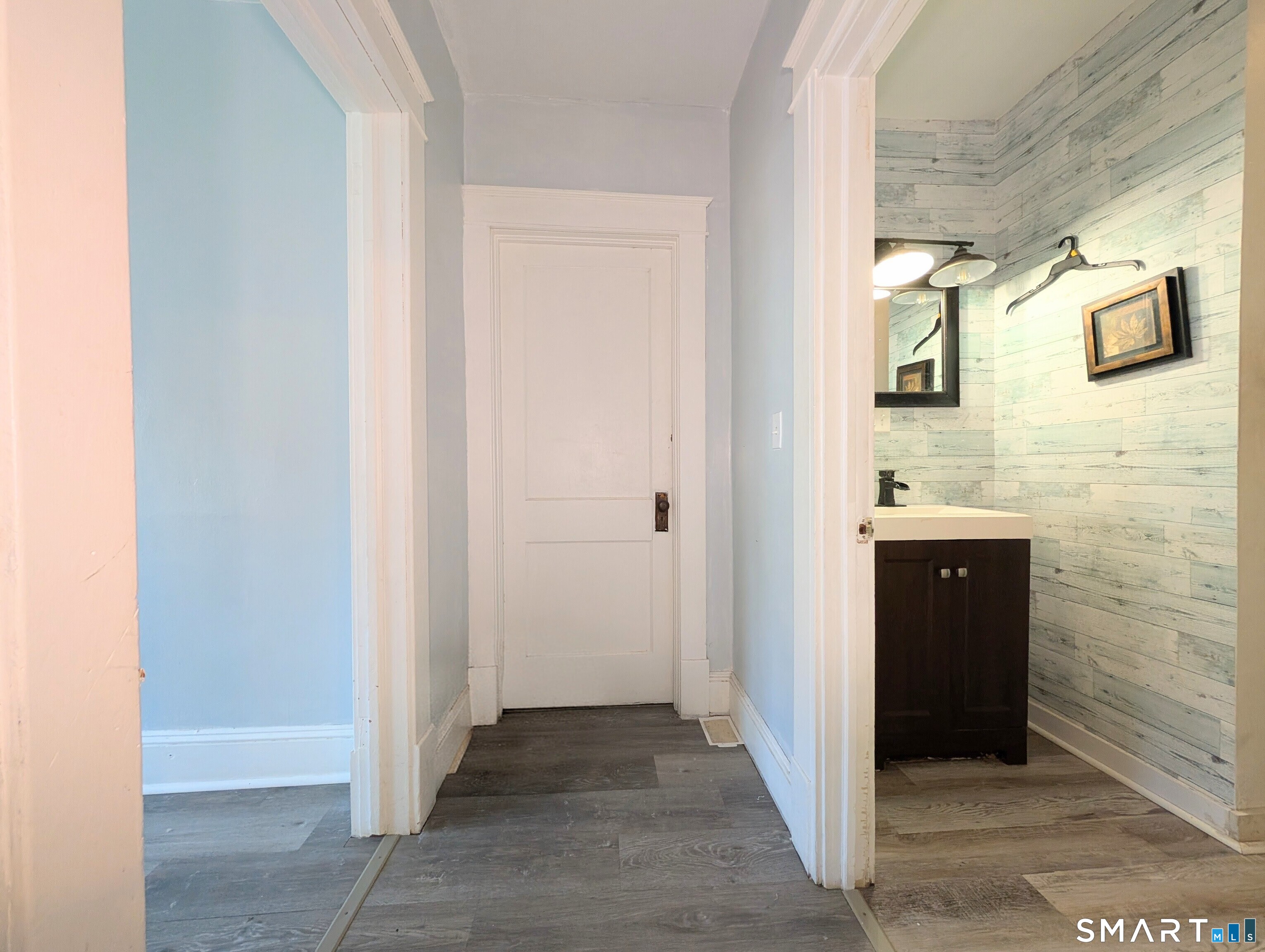 905 Cooke Street Waterbury, CT 06704 - Photo 30 of 42 a bathroom with a sink and a mirror