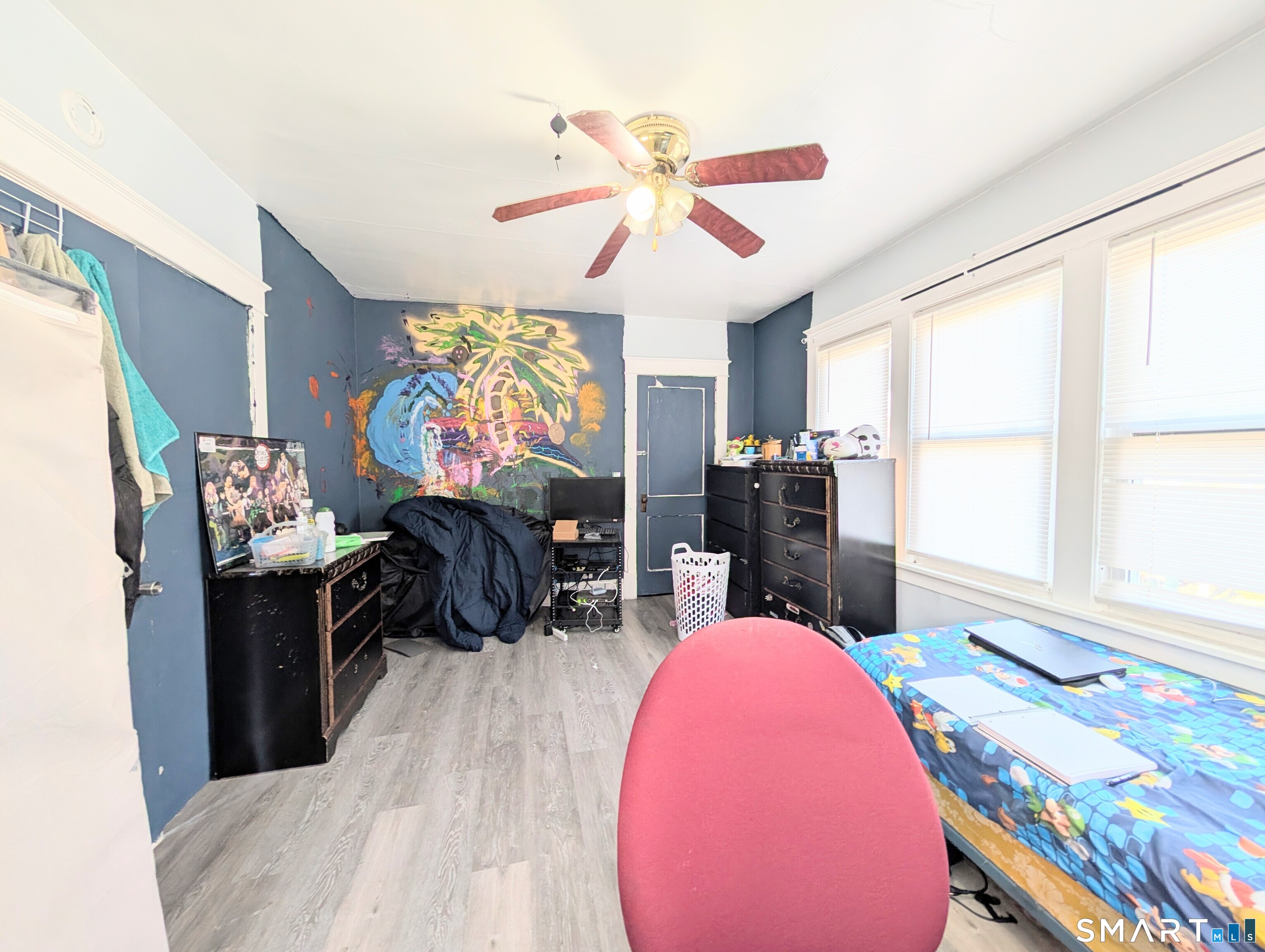 905 Cooke Street Waterbury, CT 06704 - Photo 37 of 42 a living room with furniture and a flat screen tv