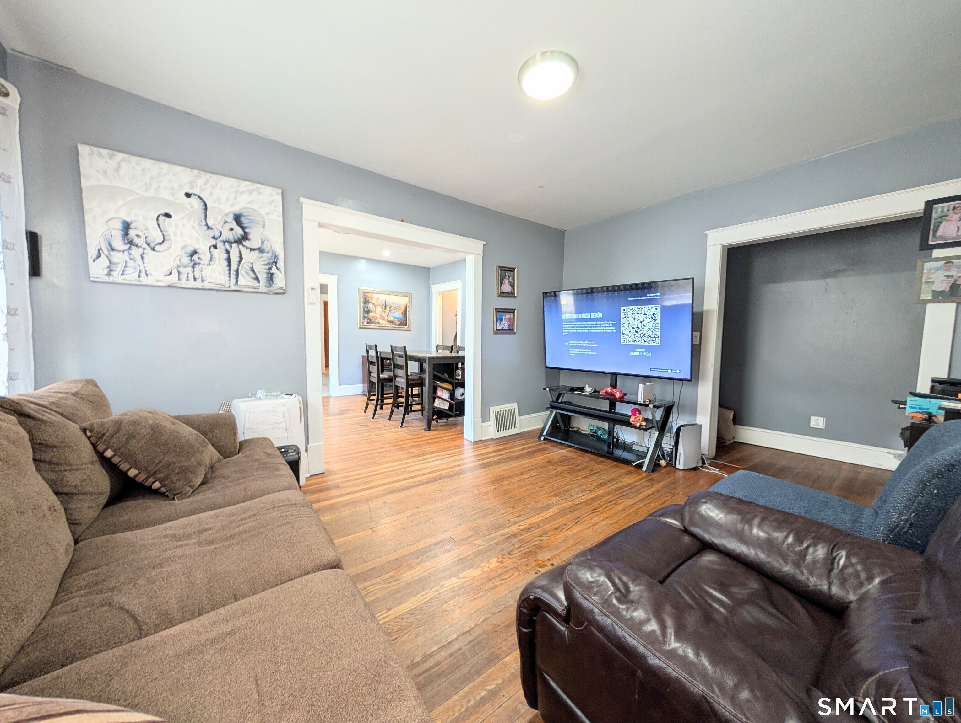 905 Cooke Street Waterbury, CT 06704 - Photo 9 of 42 a living room with furniture and a flat screen tv