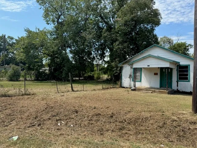 a house with trees in the background