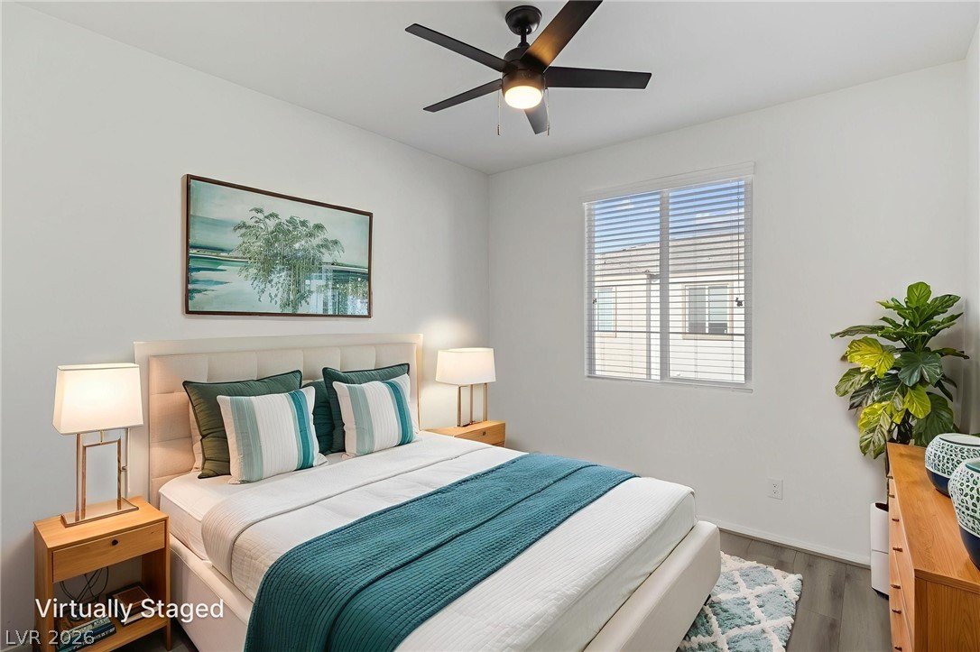 6227 Runestone Street Las Vegas, NV 89113 - Photo 7 of 33 This serene bedroom offers a tranquil retreat with soft lighting and a calming ambiance.