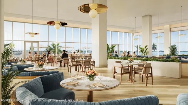 a dining room with furniture a large window and plants