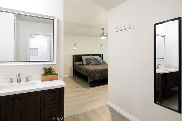 a en suite bathroom with a sink and a mirror
