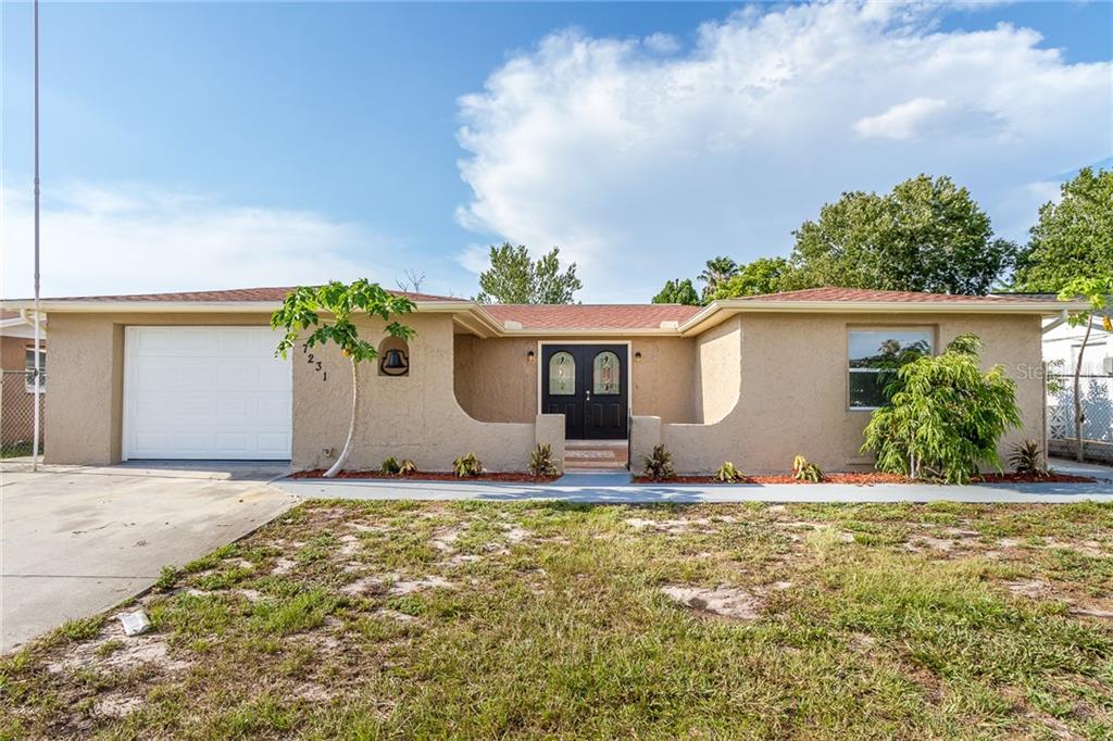 7231 Heath Drive Port Richey, FL 34668 - Photo 1 of 1 a view of a house with swimming pool and sitting area