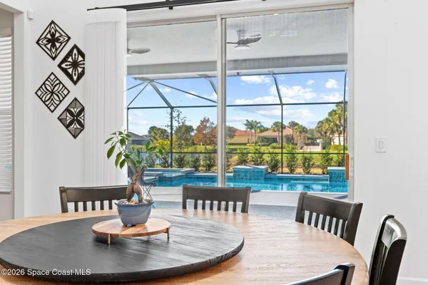 a view of swimming pool with outdoor seating