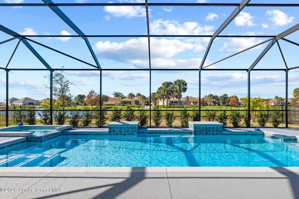 a view of pool with a backyard