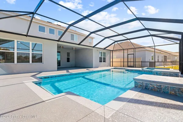 a view of swimming pool from a balcony