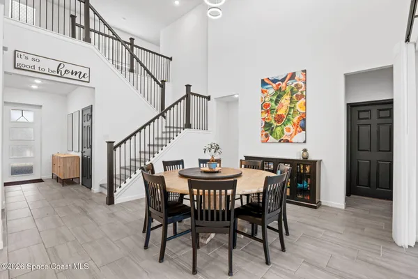 a bathroom with a granite countertop sink a toilet and a mirror