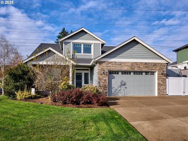 a front view of a house with a garden