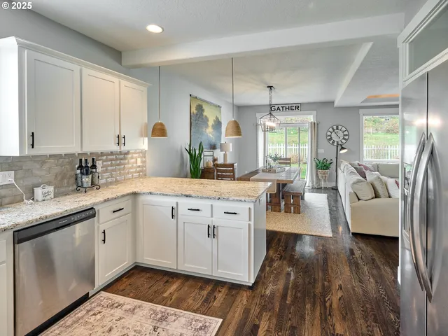a spacious bathroom with a granite countertop sink mirror and a bath tub