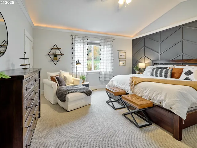 a spacious bedroom with a bed and a couch