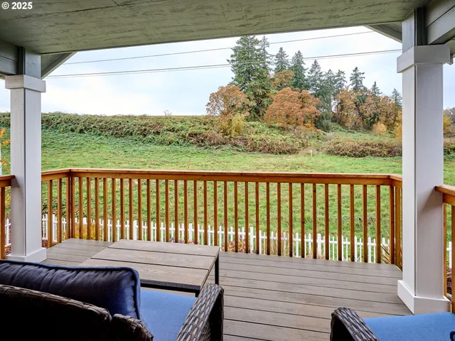 a view of a balcony with furniture
