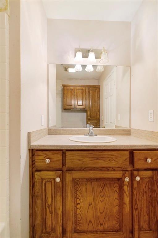 3754 County Road Paris, TX 75462 - Photo 12 of 33 a bathroom with a sink and a mirror
