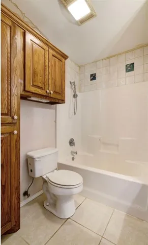 a bathroom with a toilet a sink and a bathtub