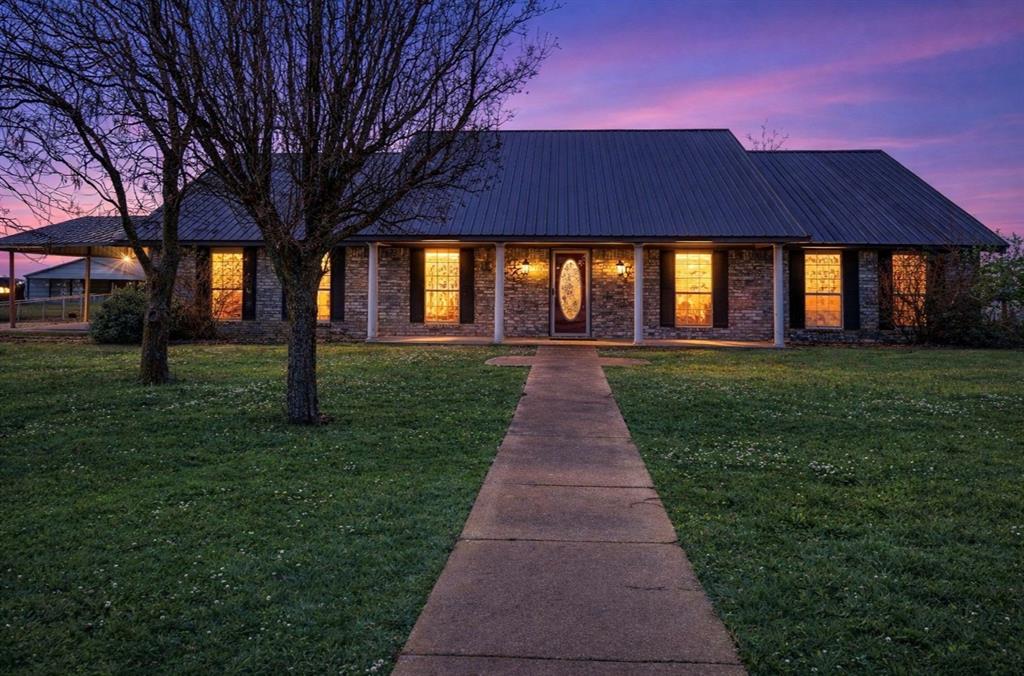 3754 County Road Paris, TX 75462 - Photo 2 of 33 a front view of a house with a yard