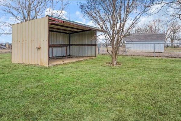 a view of backyard with green space