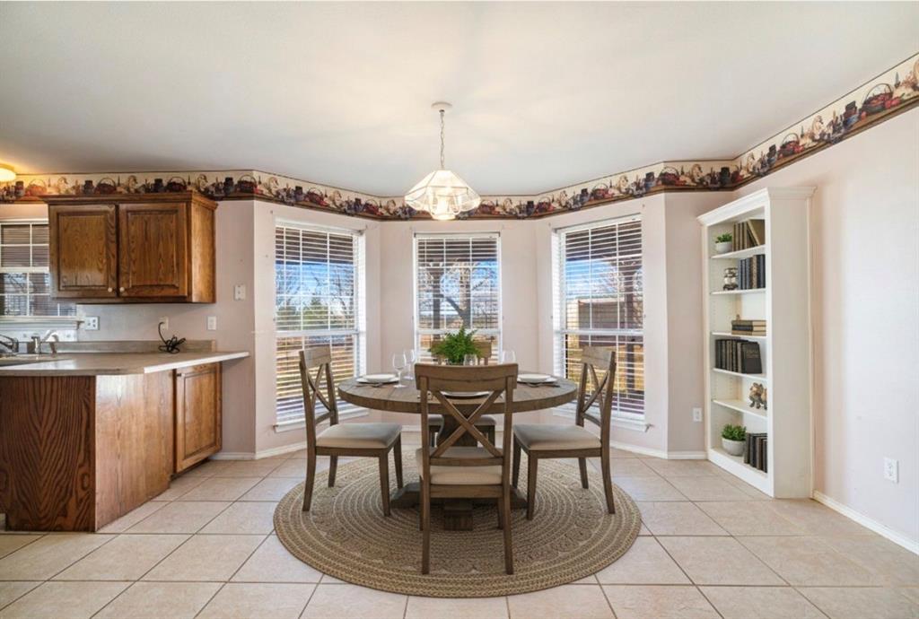 3754 County Road Paris, TX 75462 - Photo 30 of 33 a dining room with furniture a chandelier and window