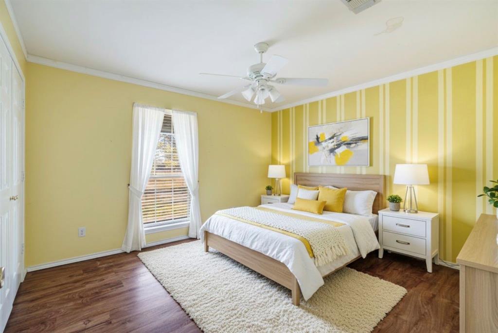 3754 County Road Paris, TX 75462 - Photo 32 of 33 a bedroom with a bed lamps and a large window