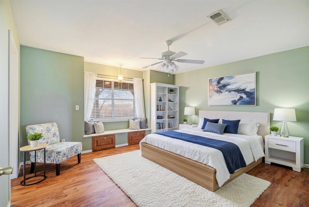 3754 County Road Paris, TX 75462 - Photo 33 of 33 a spacious bedroom with a bed a chandelier and a window