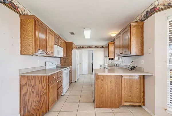 a large kitchen with a sink