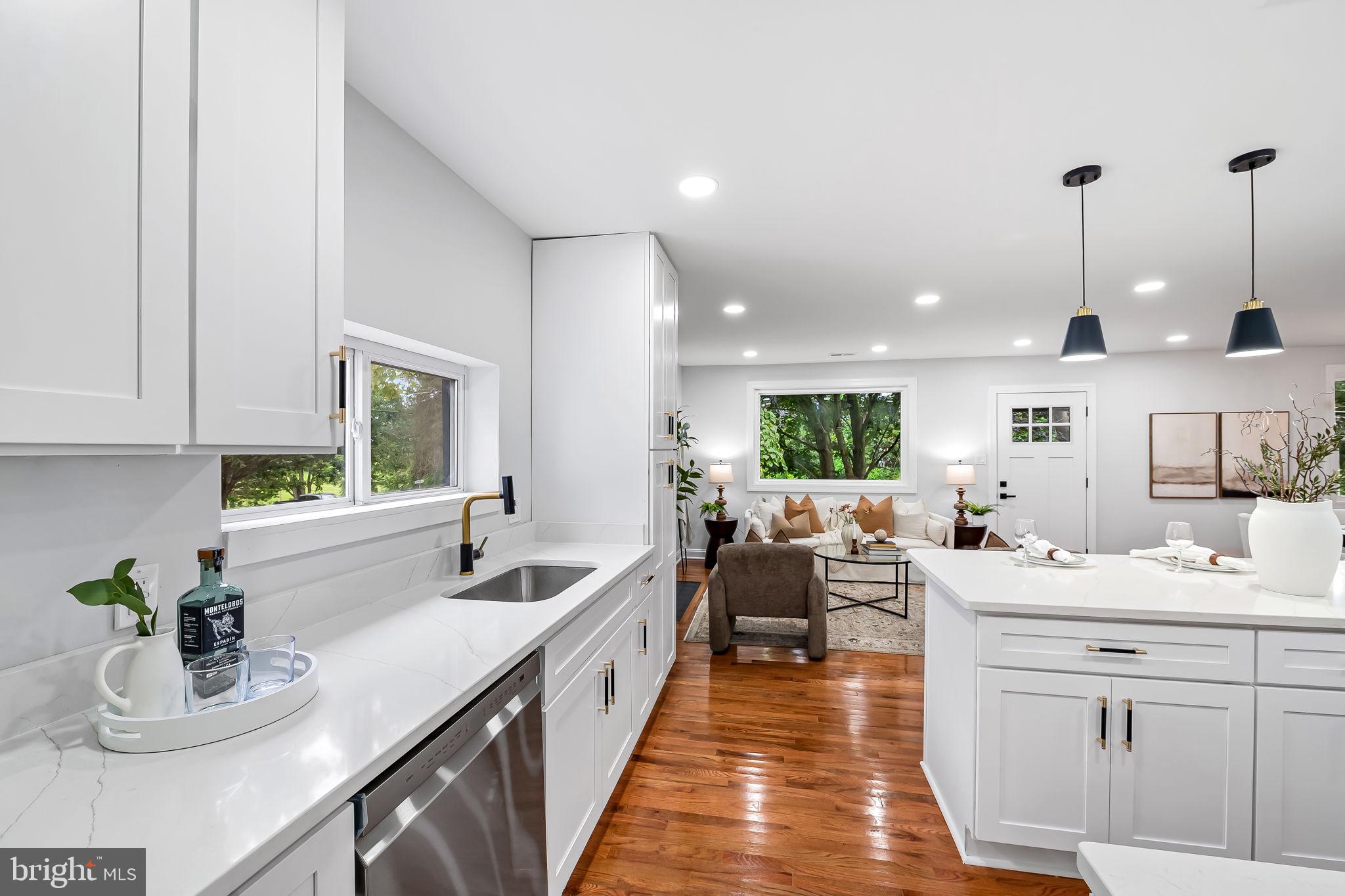 6751 White Rock Road Sykesville, MD 21784 - Photo 15 of 44 a kitchen with sink cabinets and living room view