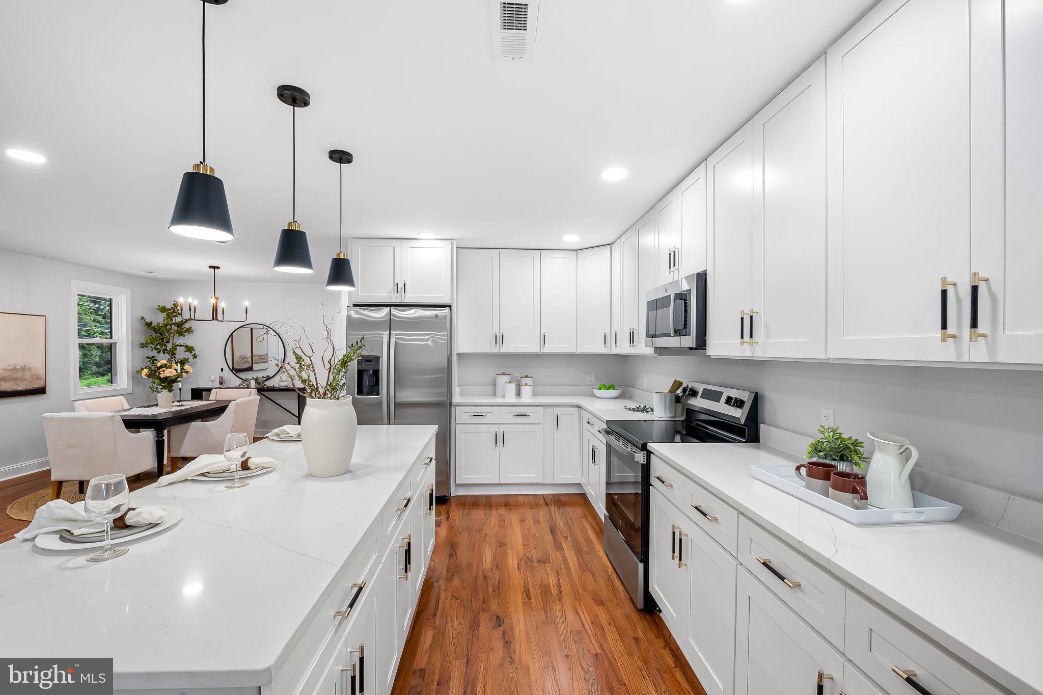 6751 White Rock Road Sykesville, MD 21784 - Photo 16 of 44 a kitchen with a sink stove and cabinets
