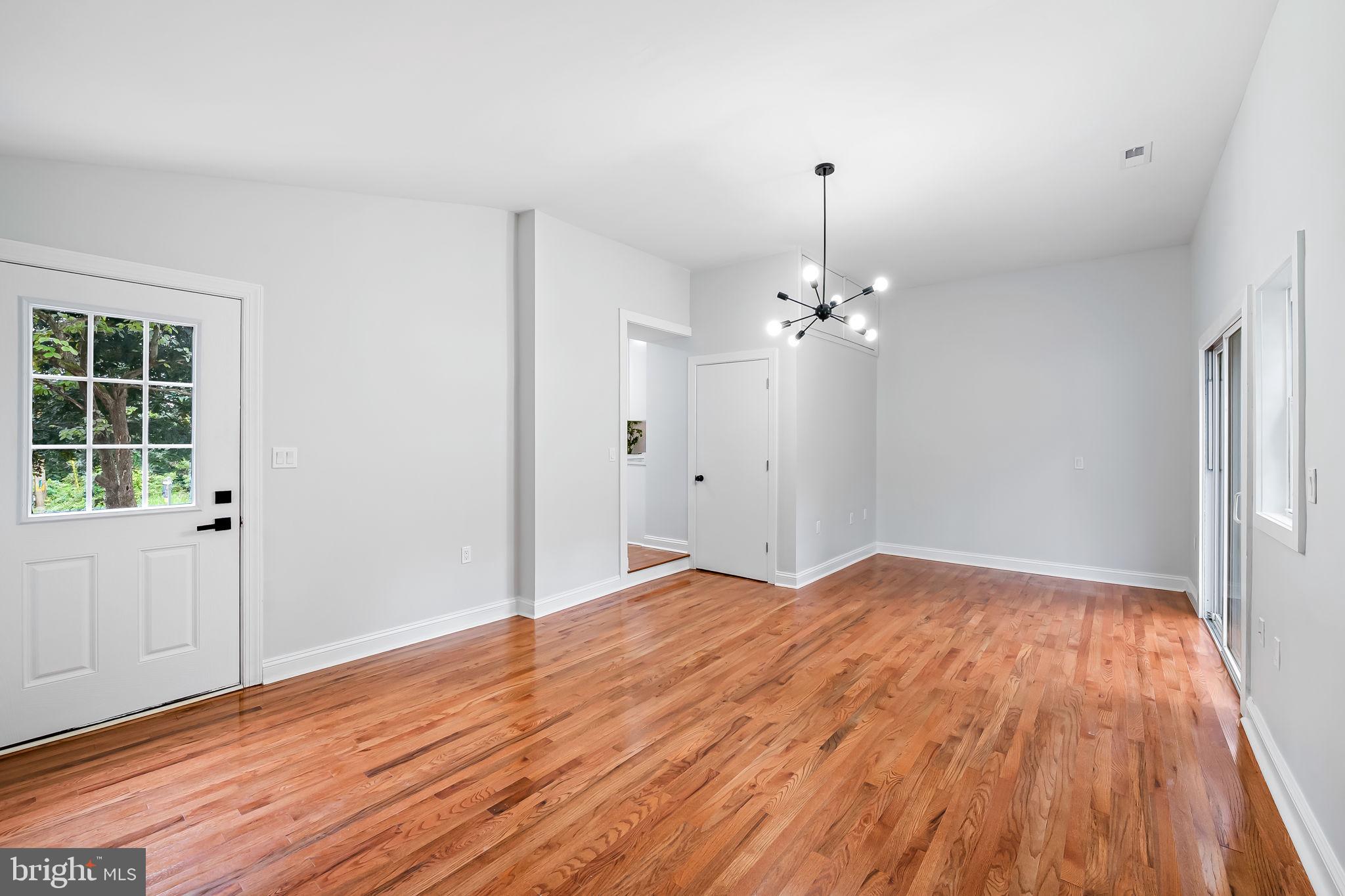 6751 White Rock Road Sykesville, MD 21784 - Photo 21 of 44 a view of empty room with wooden floor and fan