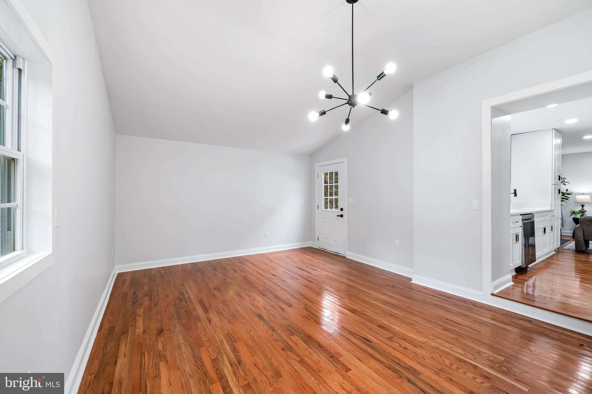 6751 White Rock Road Sykesville, MD 21784 - Photo 22 of 44 a view of empty room with wooden floor and fan