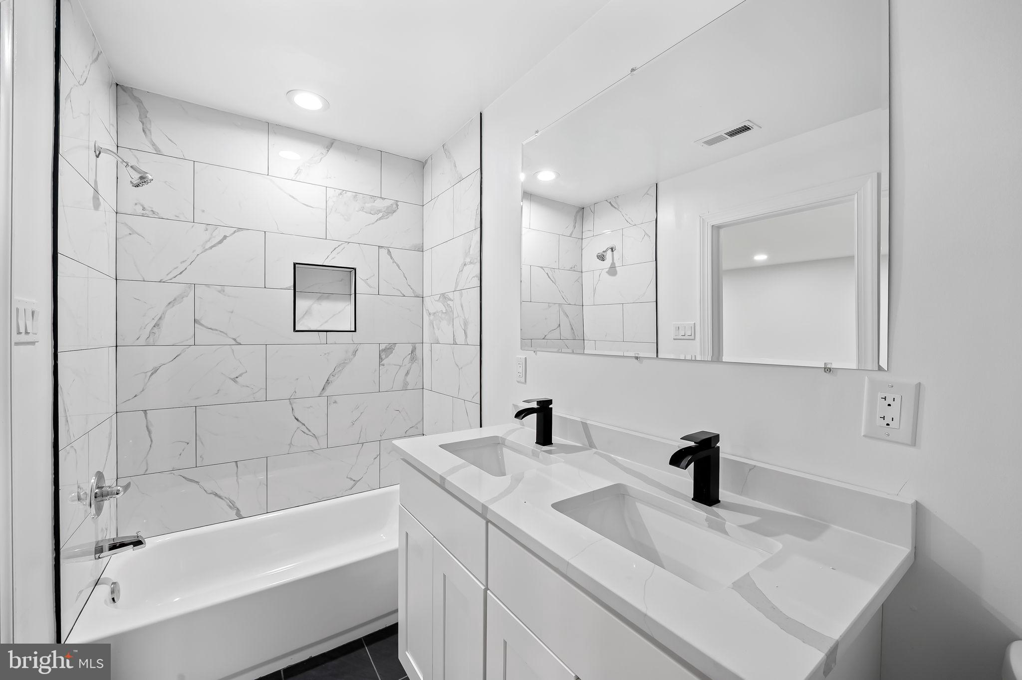 6751 White Rock Road Sykesville, MD 21784 - Photo 30 of 44 a bathroom with a bathtub sink vanity and mirror