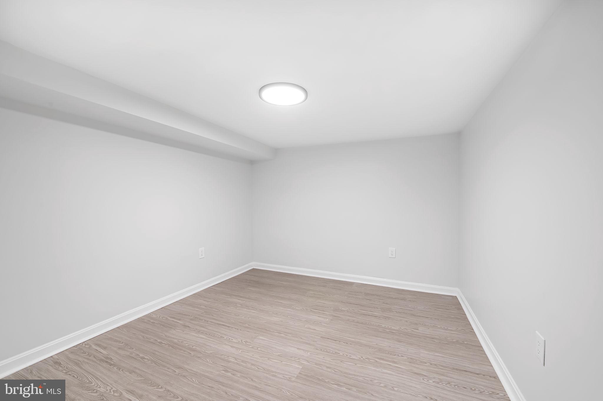 6751 White Rock Road Sykesville, MD 21784 - Photo 38 of 44 a view of a room with wooden floor and white walls