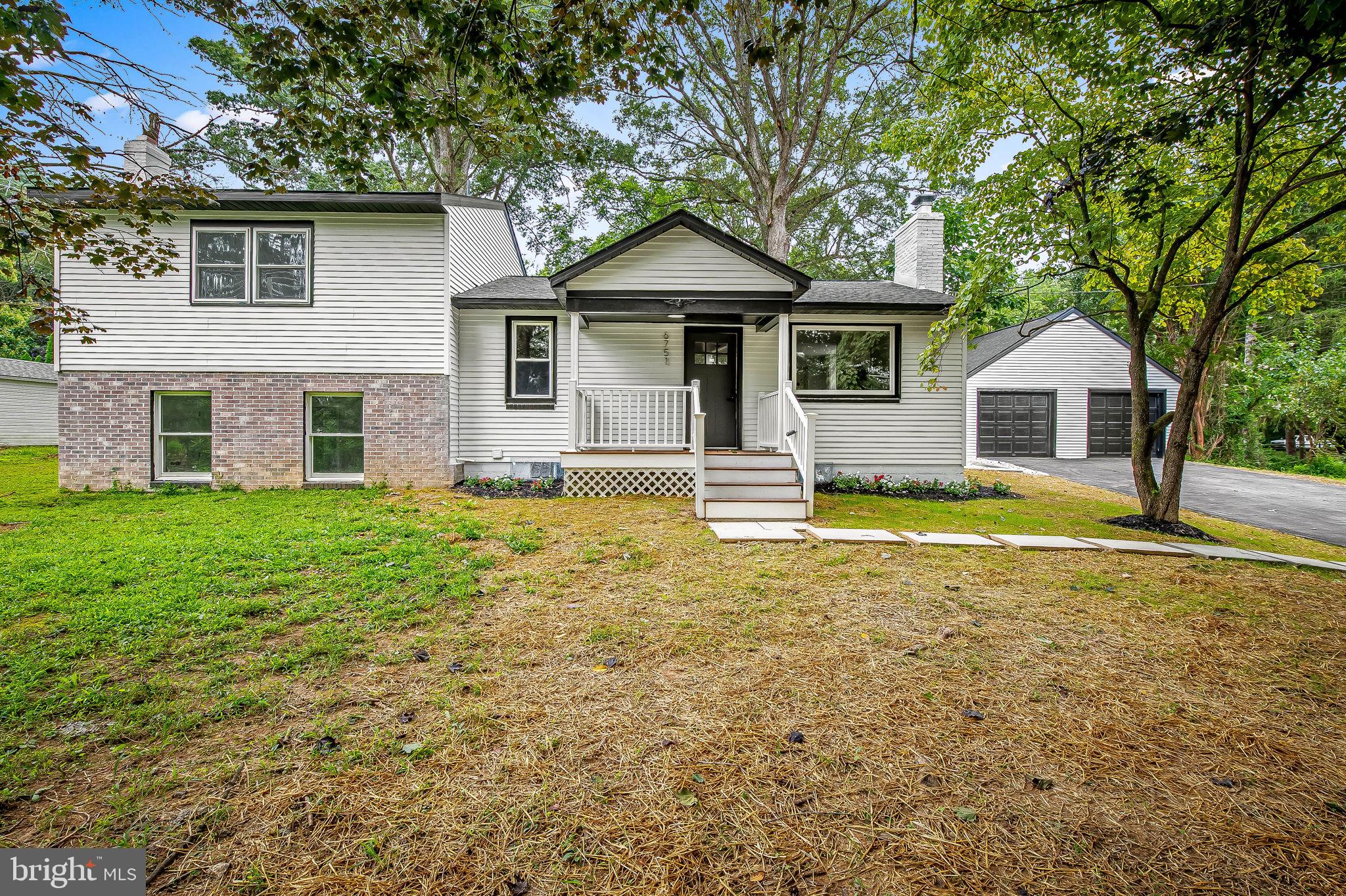 6751 White Rock Road Sykesville, MD 21784 - Photo 4 of 44 a front view of a house with swimming pool and porch