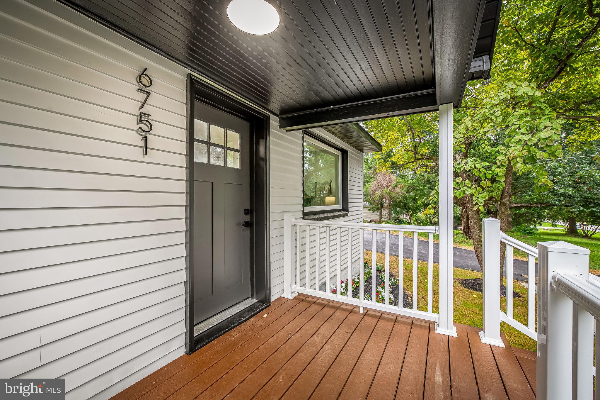 6751 White Rock Road Sykesville, MD 21784 - Photo 8 of 44 a view of porch with wooden floor