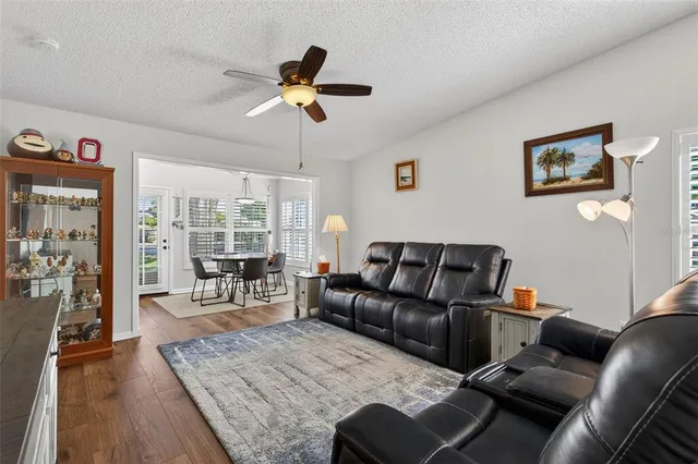 a living room with furniture and a lamp