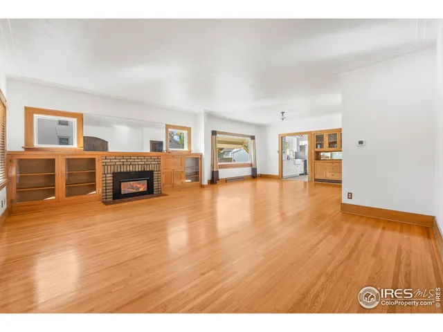 a view of living room with furniture and fireplace