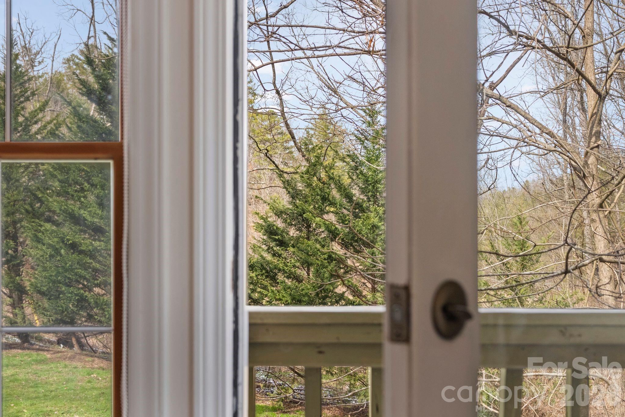20 McDaris Road Weaverville, NC 28787 - Photo 12 of 15 a view of a window with a tree in front of it
