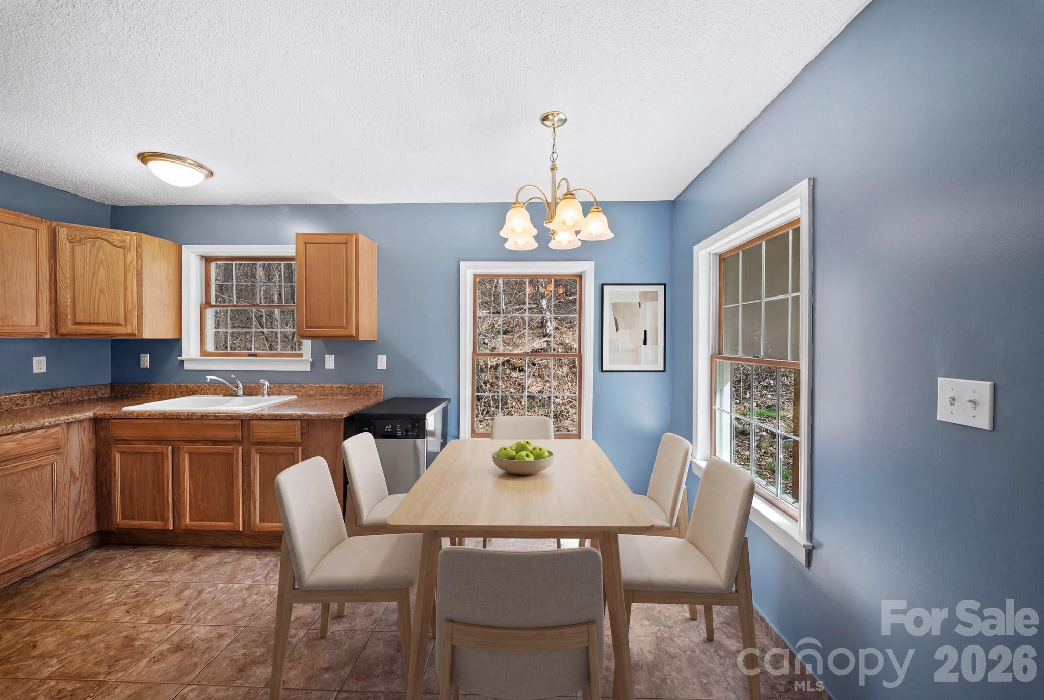 20 McDaris Road Weaverville, NC 28787 - Photo 4 of 15 a view of a dining room with furniture window and outside view
