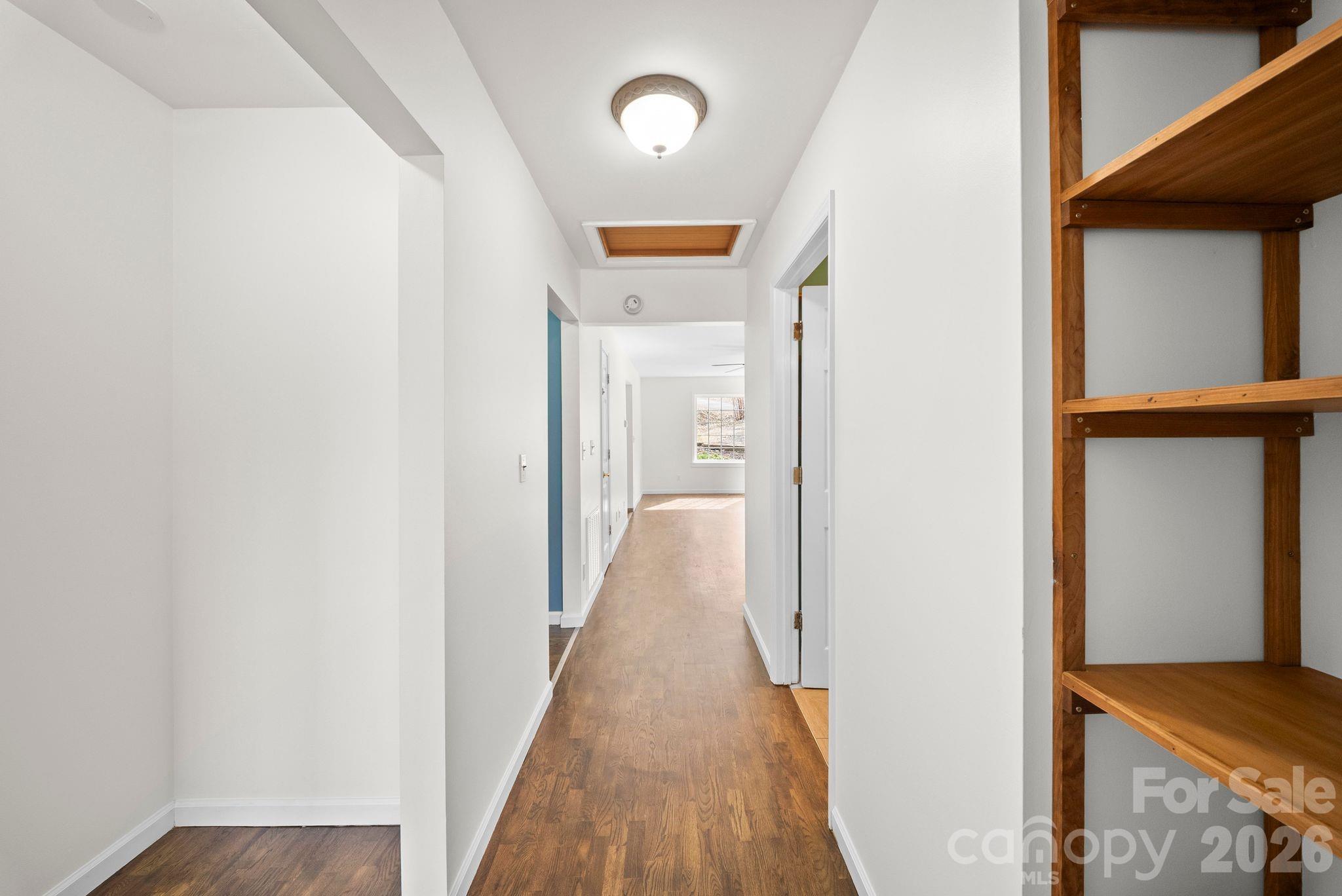 20 McDaris Road Weaverville, NC 28787 - Photo 9 of 15 a view of a hallway with wooden floor and staircase