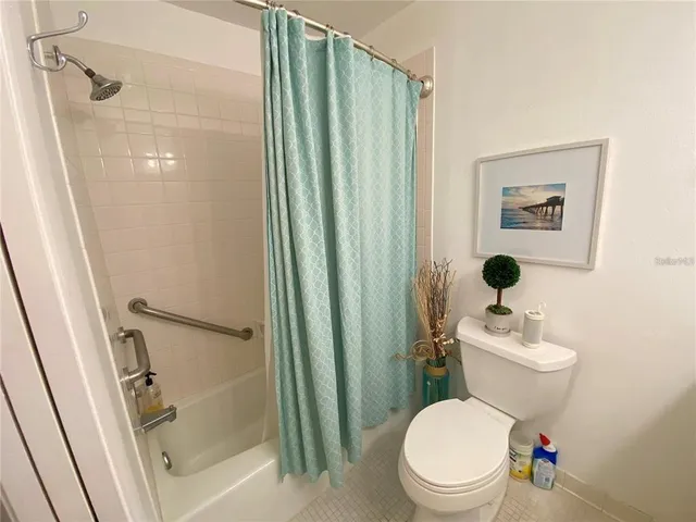 a bathroom with a sink toilet and mirror