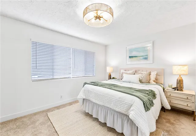 a en suite bathroom with a sink double vanity and a mirror