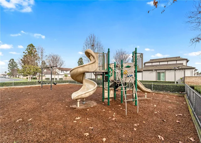 a wooden bench sitting in the middle of a park
